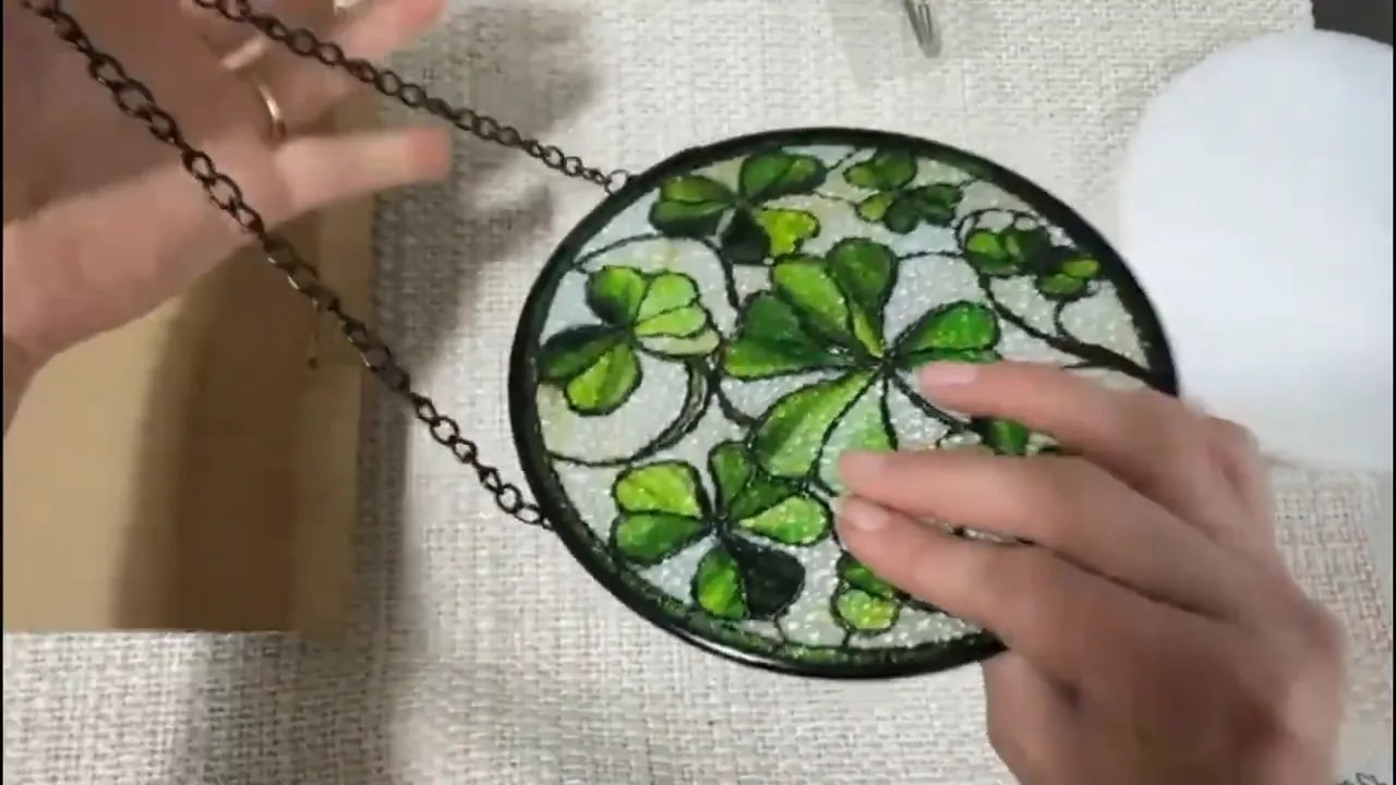 Lucky clover stained glass sun catcher close-up showing green clover pattern